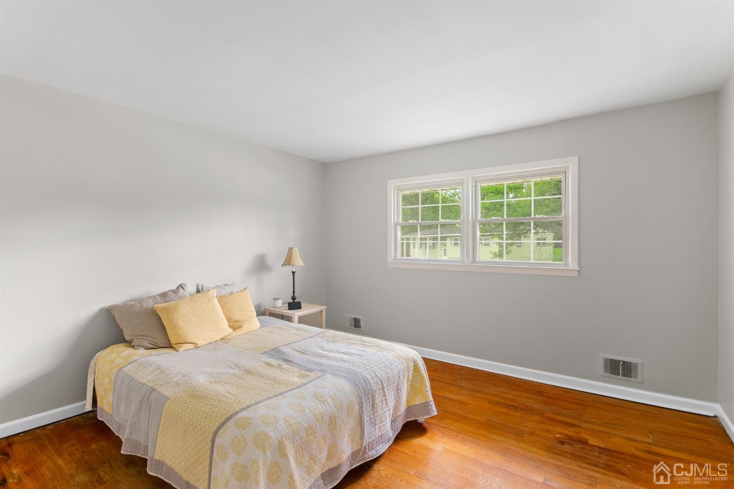 30 Wilk Road Edison, NJ 08837 - Photo 20 of 35 a bedroom with a bed and wooden floor