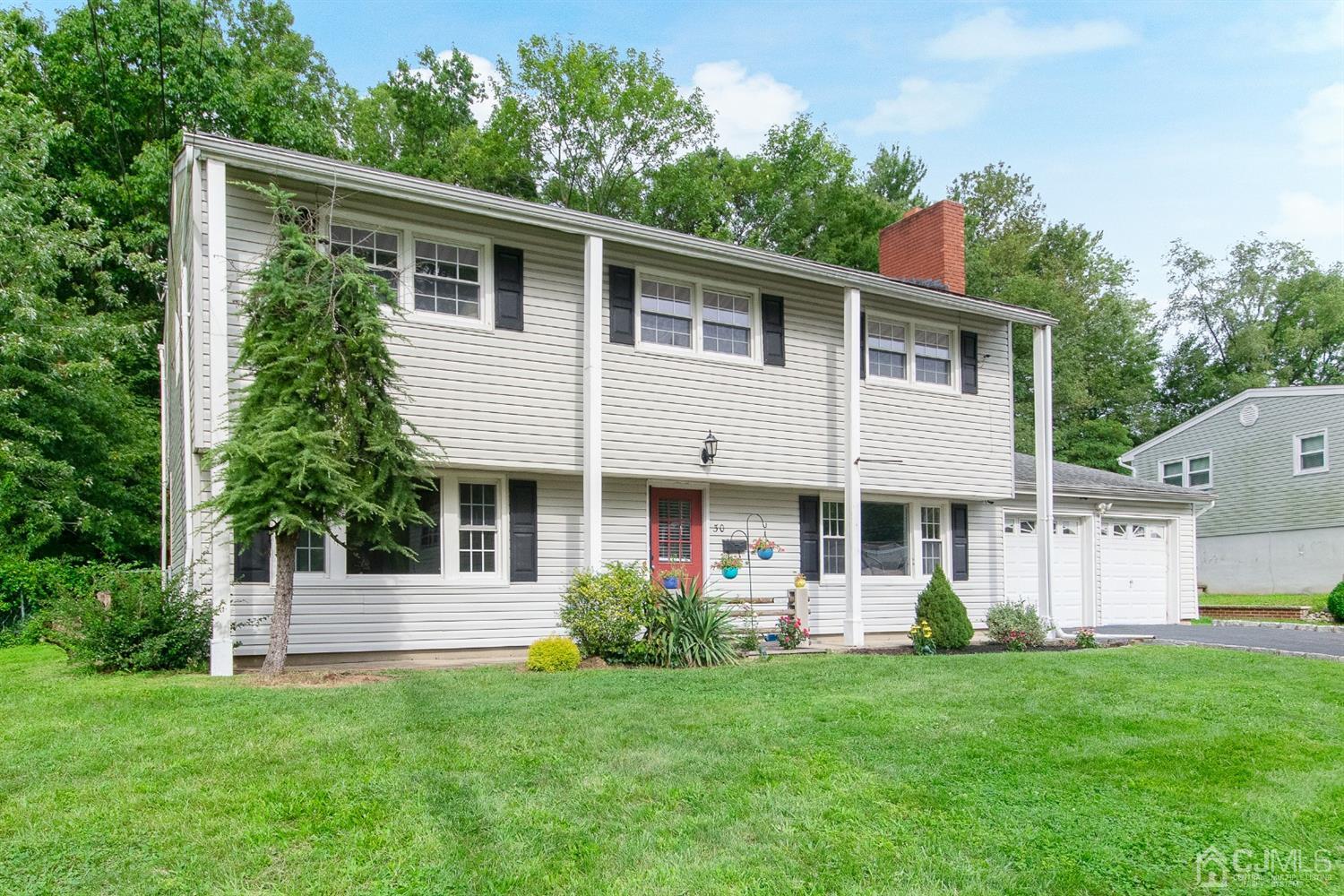 30 Wilk Road Edison, NJ 08837 - Photo 3 of 35 a front view of a house with a garden