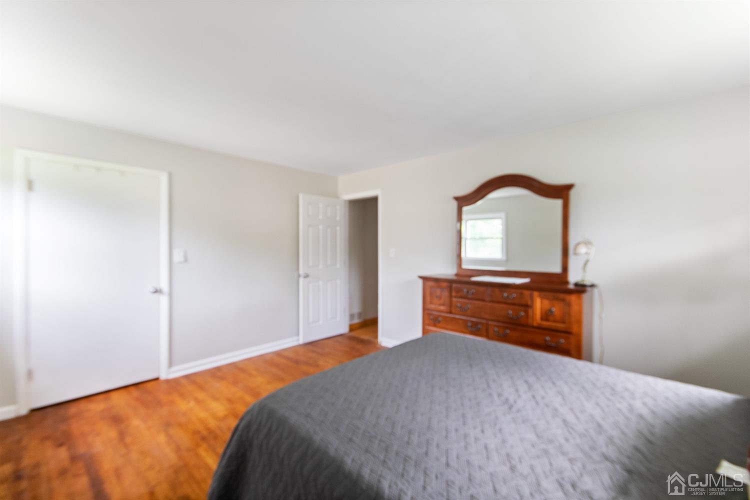 30 Wilk Road Edison, NJ 08837 - Photo 23 of 35 a bedroom with a bed and a dresser