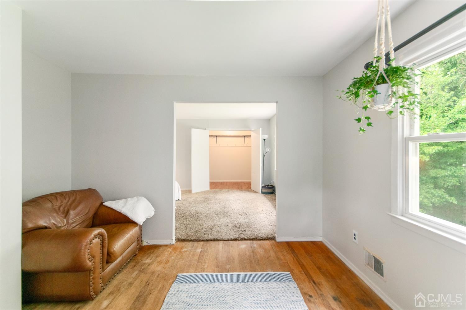 30 Wilk Road Edison, NJ 08837 - Photo 24 of 35 a living room with a couch and a potted plant