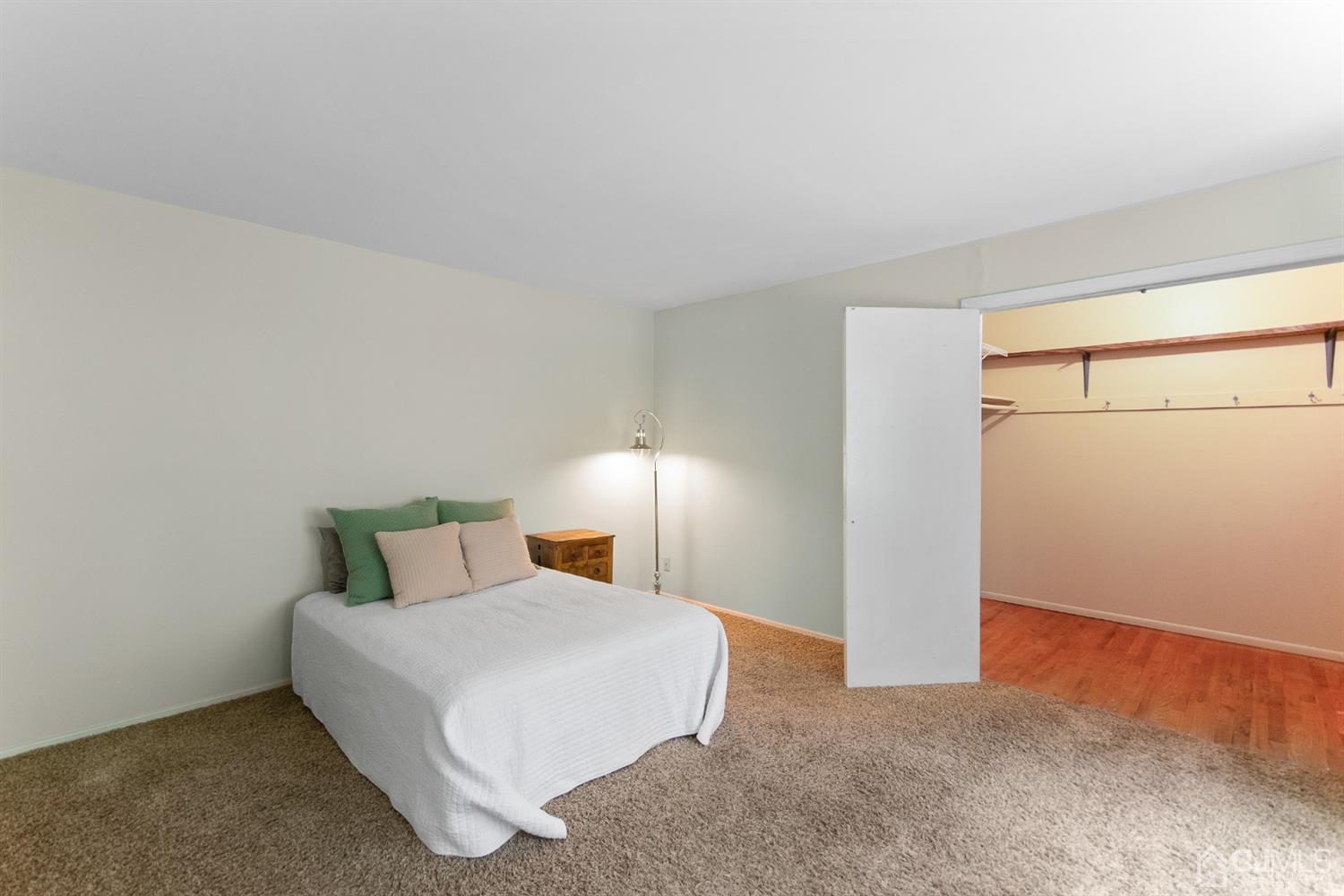 30 Wilk Road Edison, NJ 08837 - Photo 29 of 35 a bedroom with a bed and a night stand