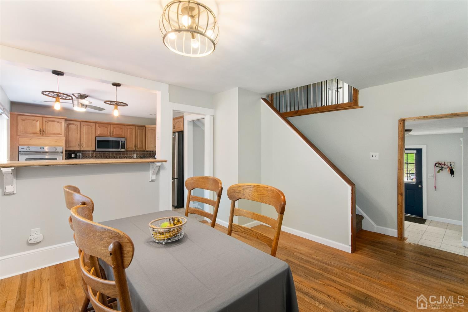30 Wilk Road Edison, NJ 08837 - Photo 7 of 35 a dining room with furniture and wooden floor