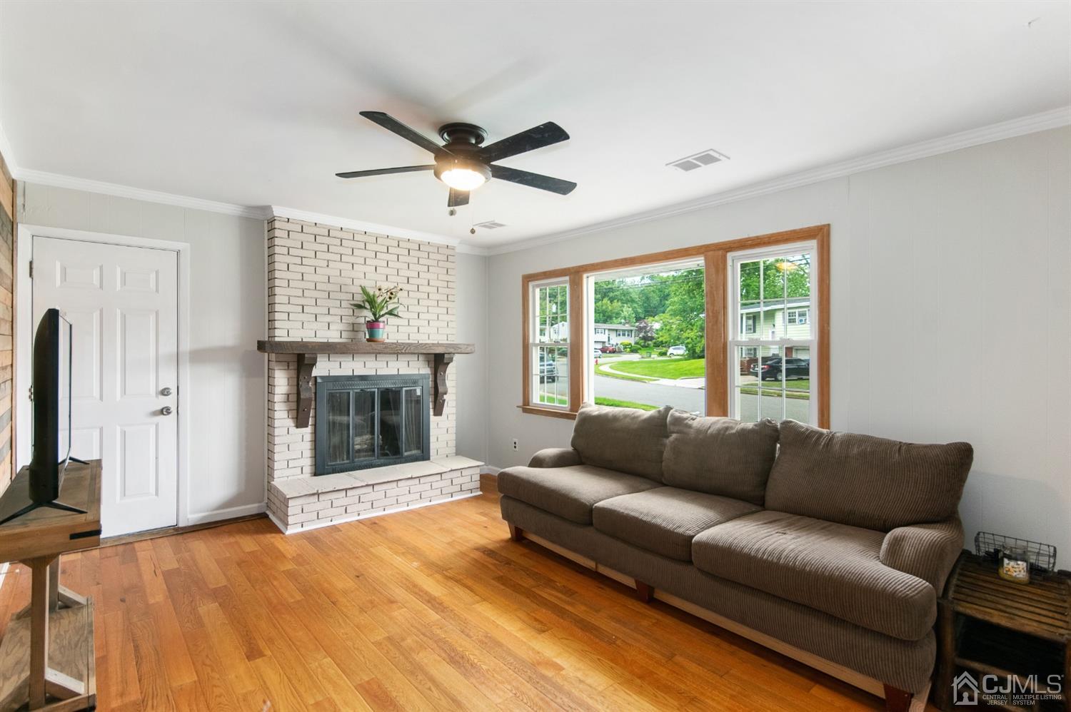 30 Wilk Road Edison, NJ 08837 - Photo 9 of 35 a living room with furniture and a fireplace
