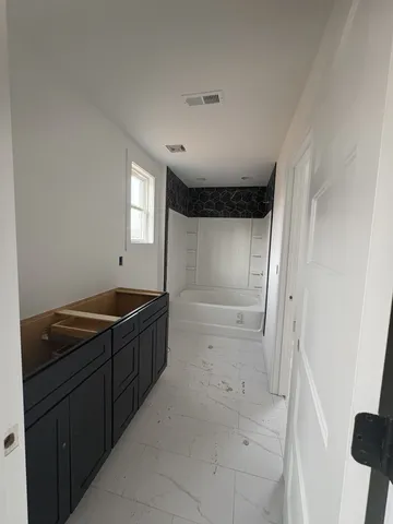 a view of an empty room with a fireplace