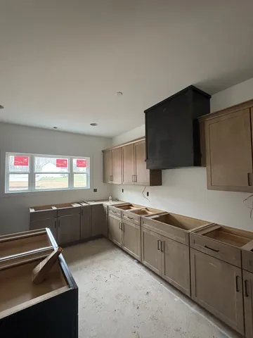 a kitchen with sink and microwave