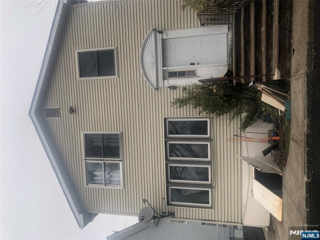 10 Ella Street Bloomfield, NJ 07003 - Photo 2 of 4 a front view of a house with stairs