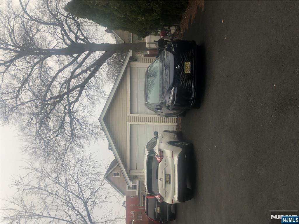 10 Ella Street Bloomfield, NJ 07003 - Photo 3 of 4 a couple of cars parked in front of a house