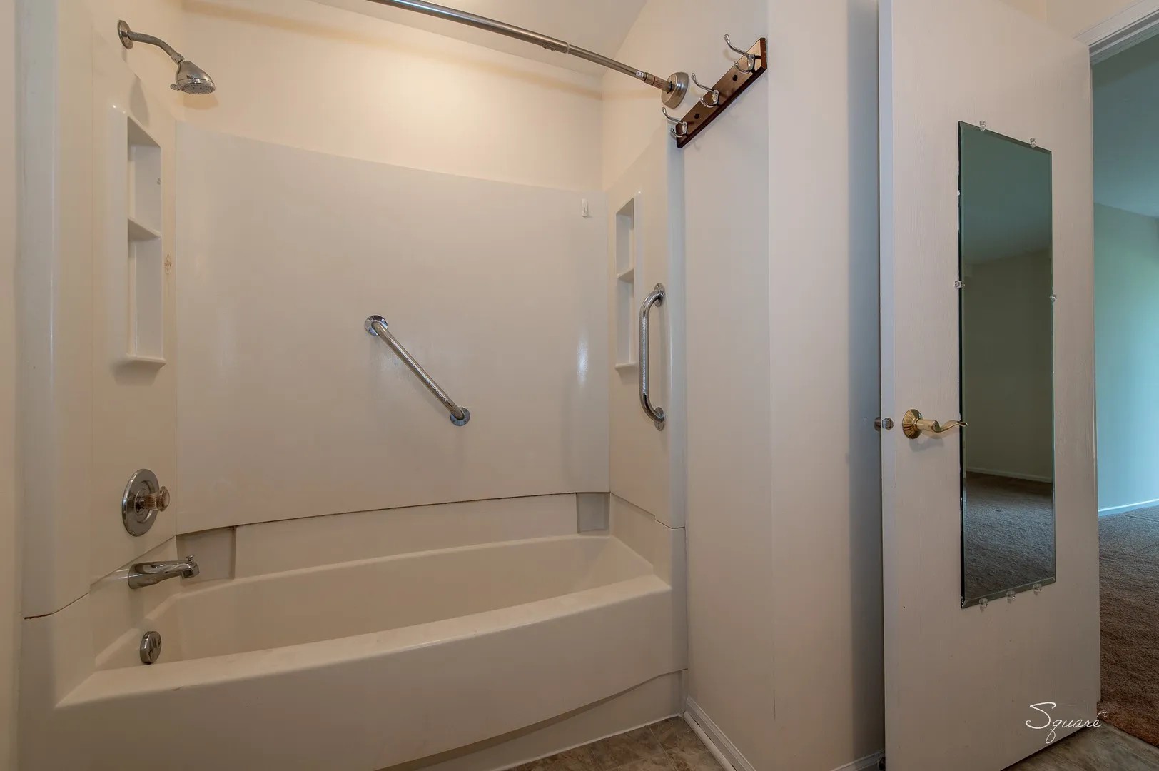 23 Taylor Court, Unit A Streamwood, IL 60107 - Photo 11 of 20 a white bath tub with a shower