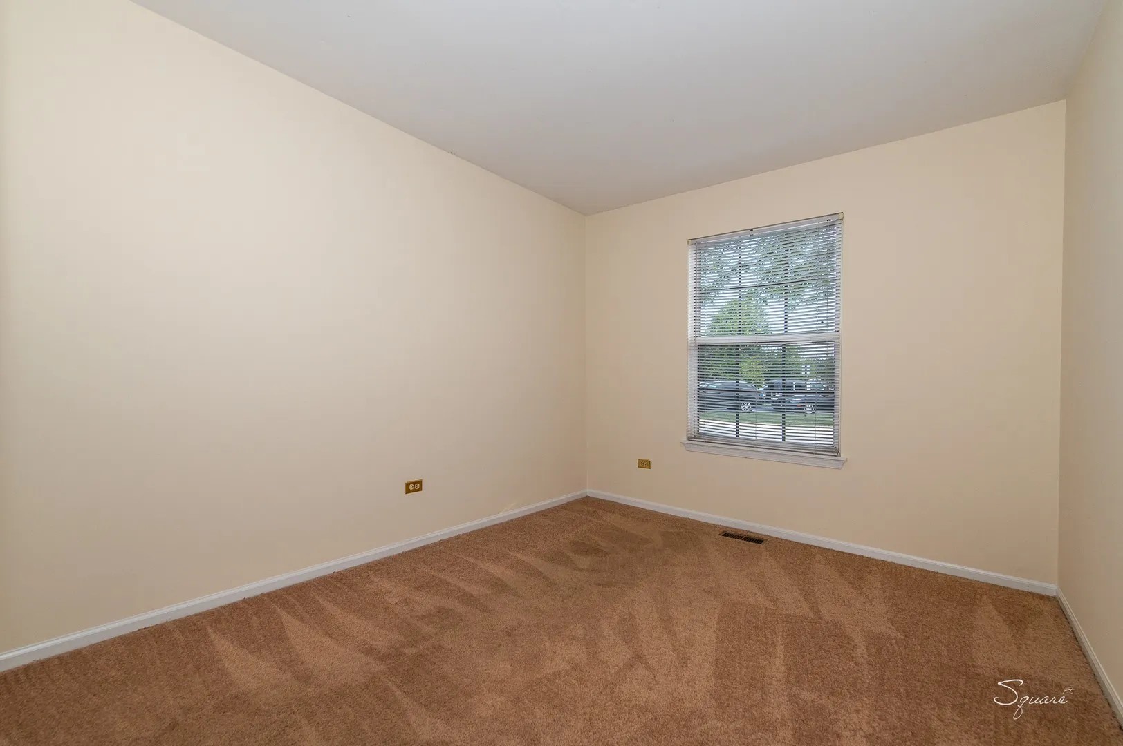 23 Taylor Court, Unit A Streamwood, IL 60107 - Photo 12 of 20 an empty room with a window