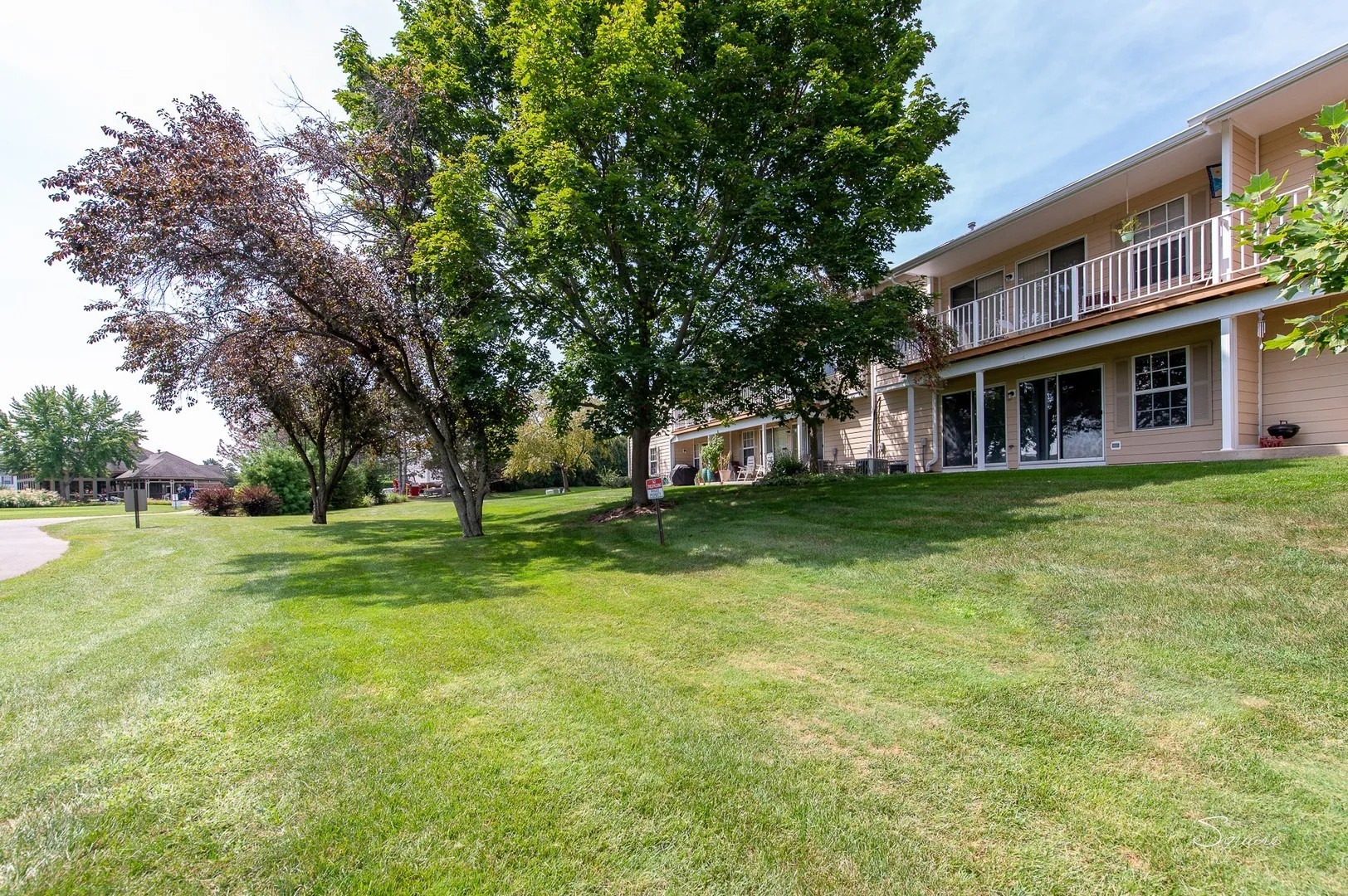 23 Taylor Court, Unit A Streamwood, IL 60107 - Photo 15 of 20 a view of a house with a big yard and palm trees
