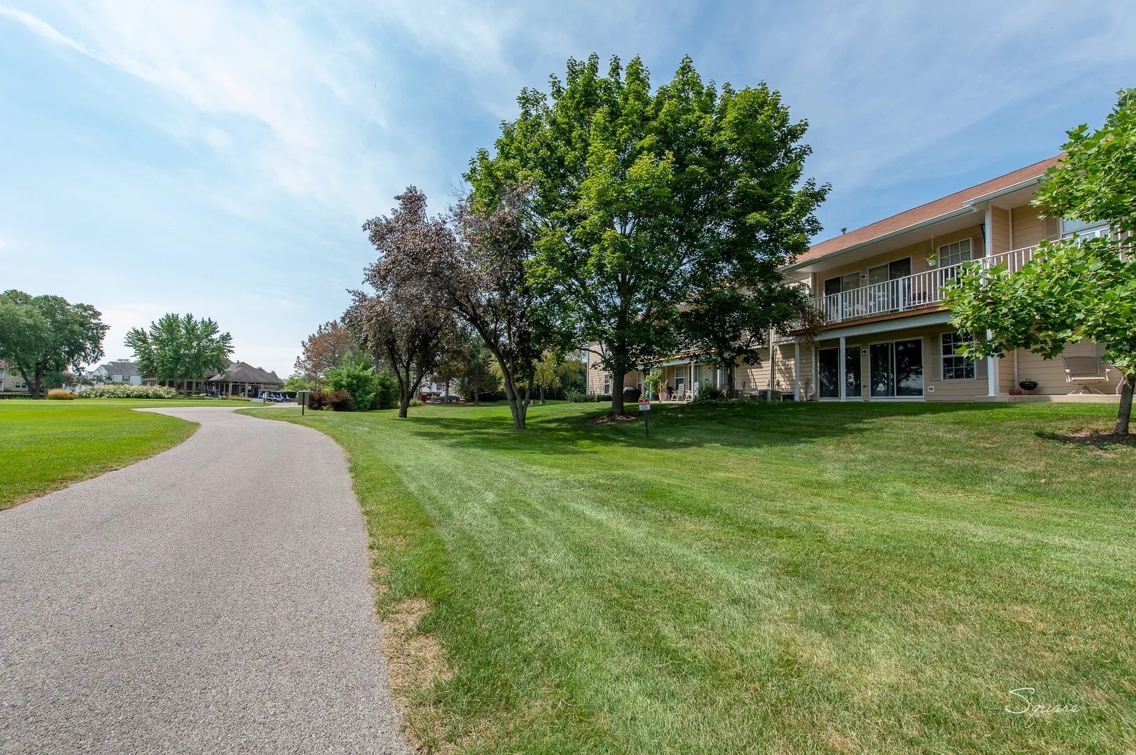 23 Taylor Court, Unit A Streamwood, IL 60107 - Photo 16 of 20 a view of house with garden and trees