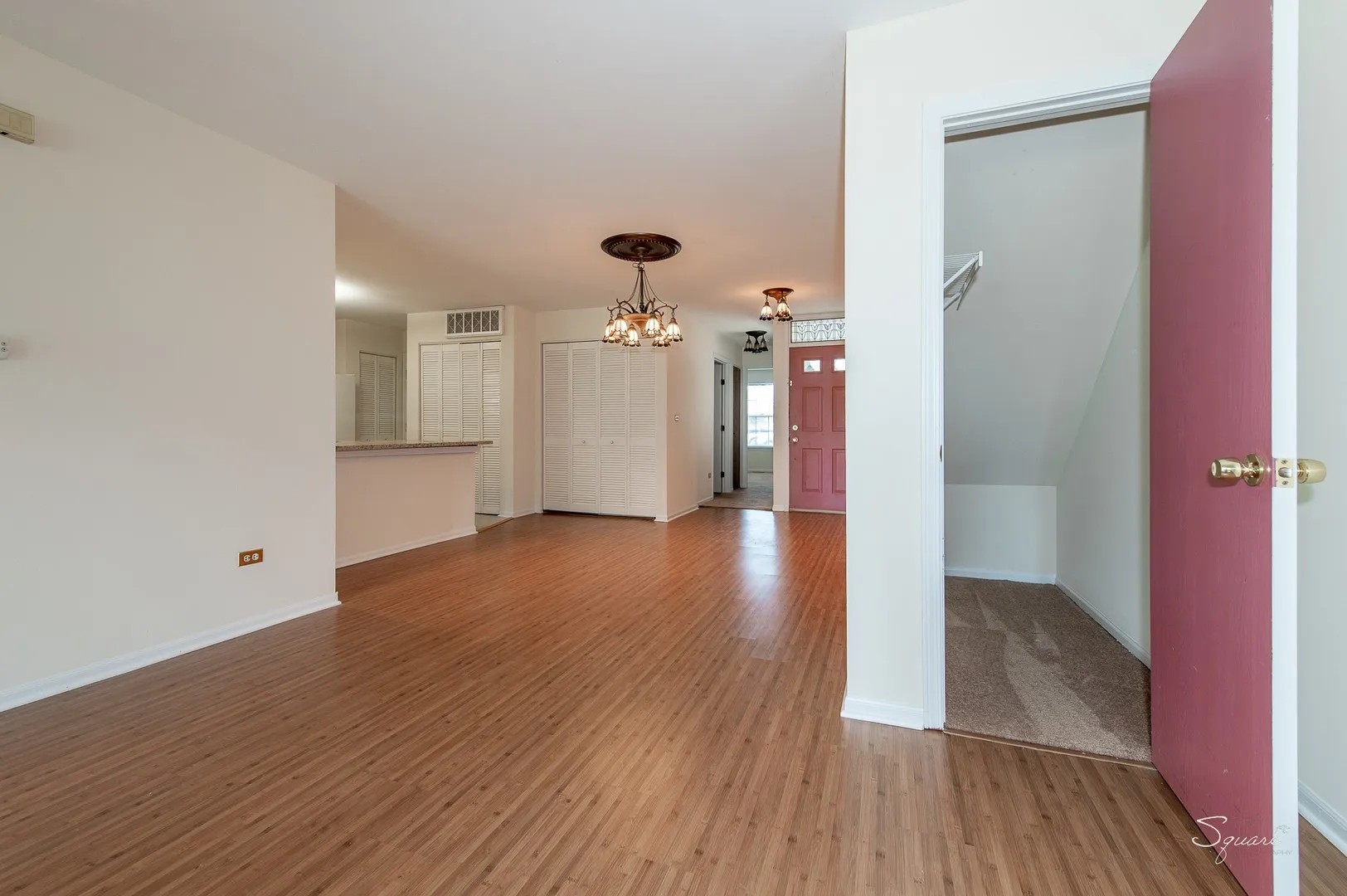 23 Taylor Court, Unit A Streamwood, IL 60107 - Photo 4 of 20 a view of a hallway with wooden floor