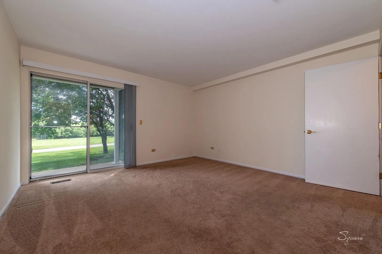 23 Taylor Court, Unit A Streamwood, IL 60107 - Photo 8 of 20 a view of an empty room with a window