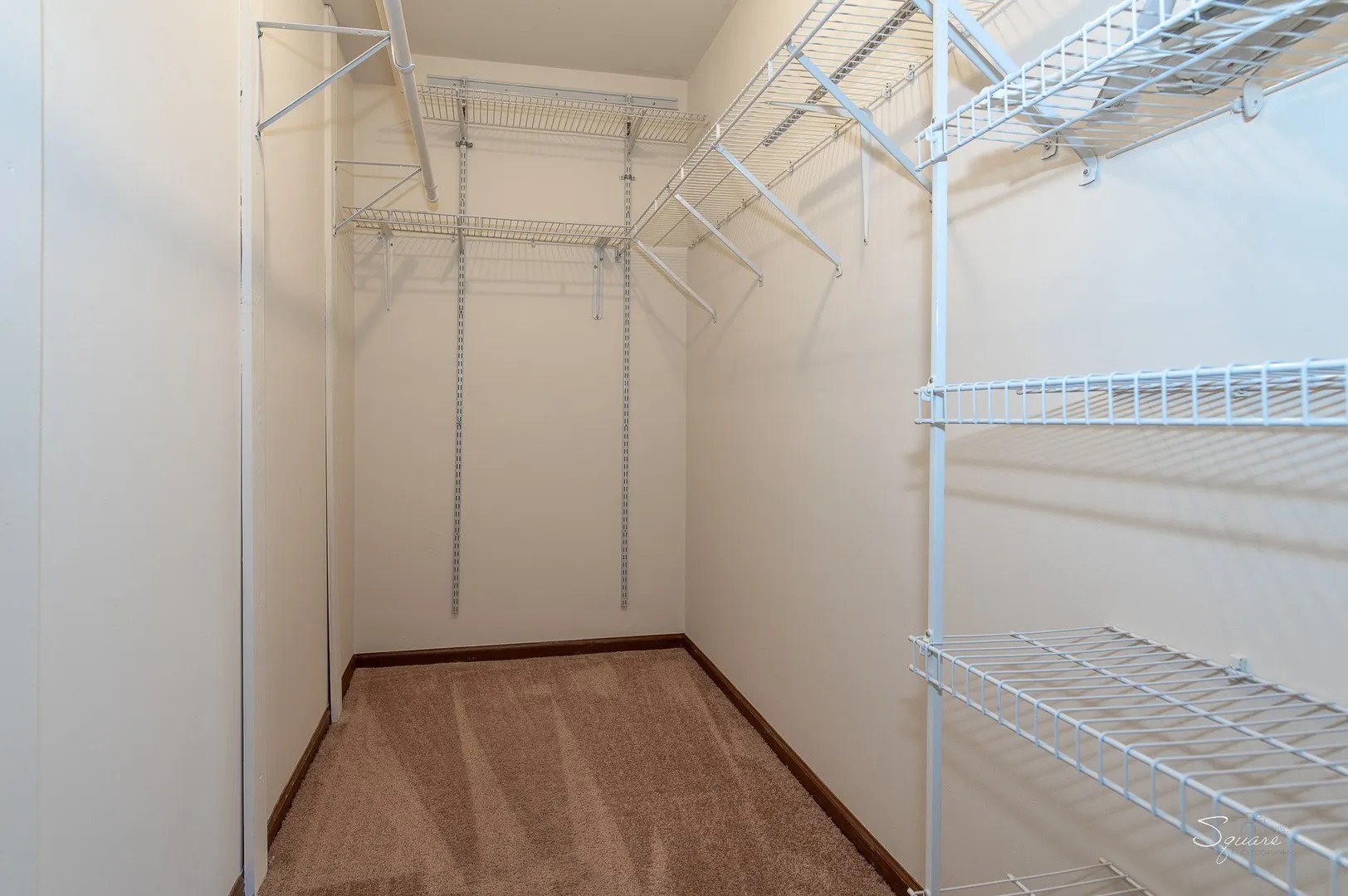 23 Taylor Court, Unit A Streamwood, IL 60107 - Photo 9 of 20 a view of a room with racks on the wall