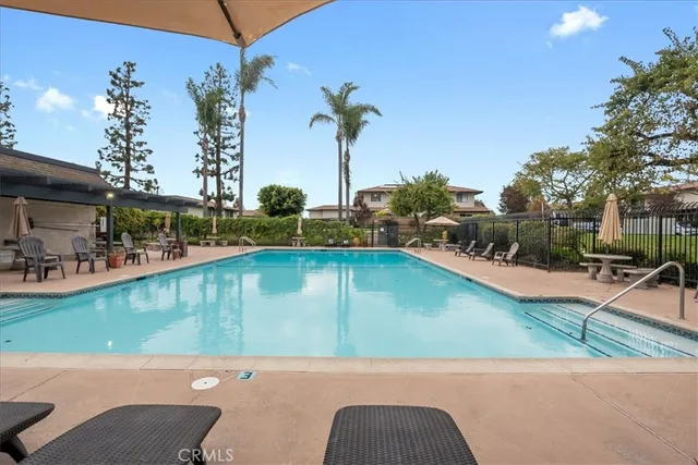 a view of a swimming pool with a patio