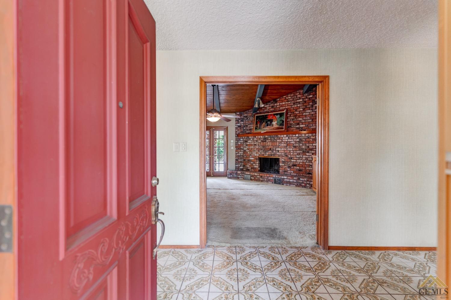 Undisclosed Address Bakersfield, CA 93309 - Photo 13 of 38 a view of a livingroom with a fireplace