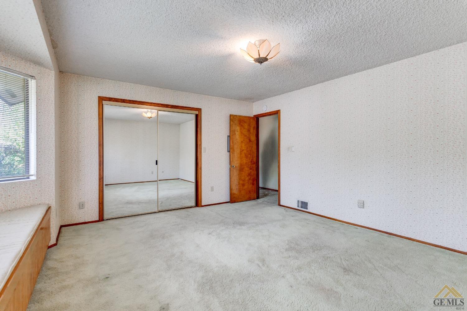 Undisclosed Address Bakersfield, CA 93309 - Photo 32 of 38 an empty room with a empty space and windows