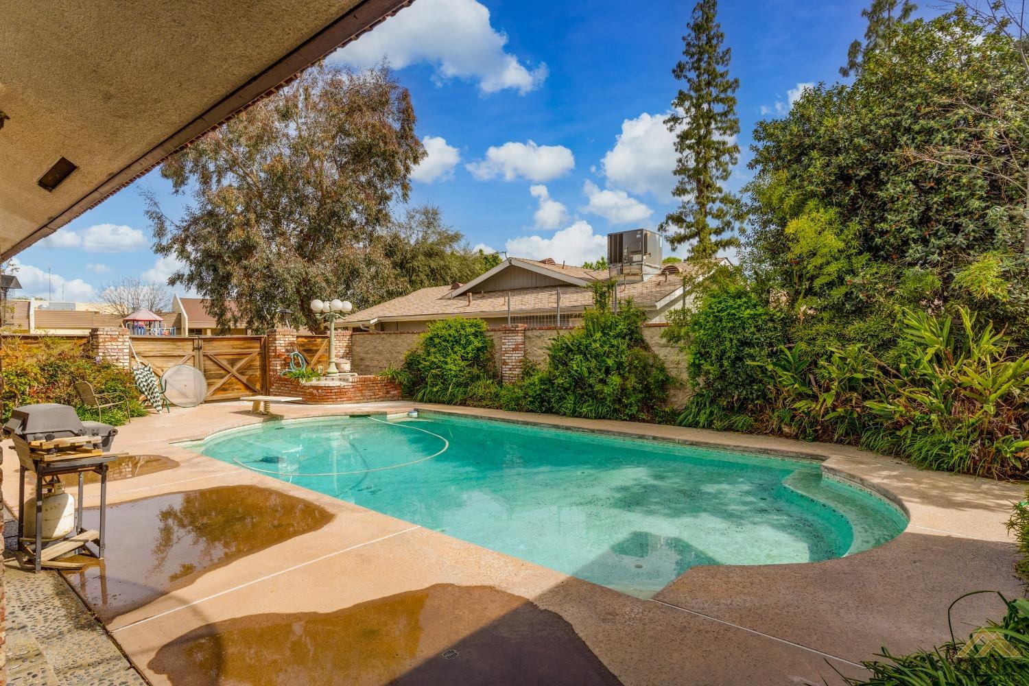 Undisclosed Address Bakersfield, CA 93309 - Photo 9 of 38 a view of a backyard with swimming pool