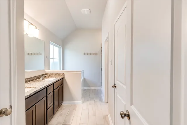 a kitchen with a sink stove and refrigerator