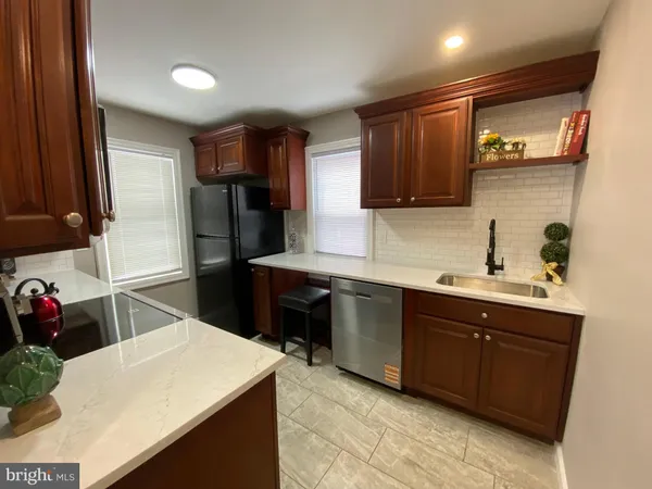 a bathroom with a sink vanity and a mirror