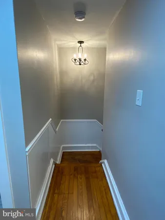 wooden floor in a hall way with wooden floor