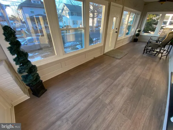 a view of an entryway door with wooden floor