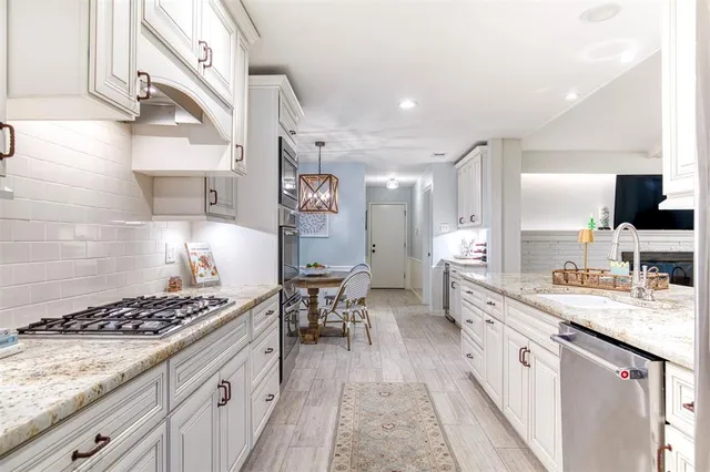 a kitchen with a stove and cabinets