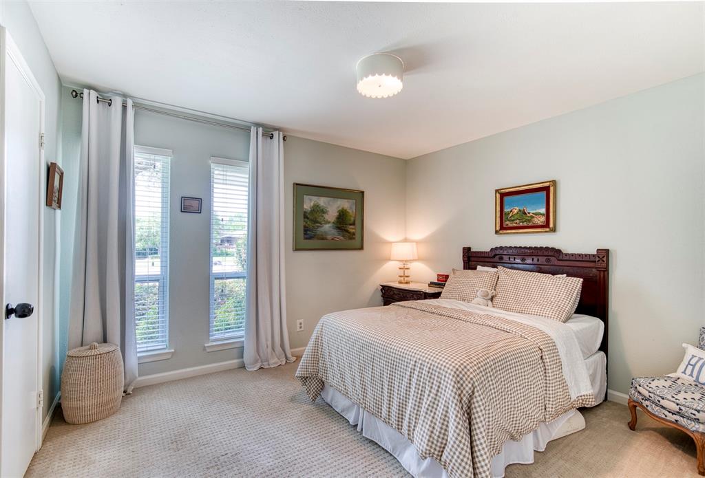 4829 Harvest Hill Dallas, TX 75244 - Photo 17 of 35 a bedroom with double bed and a window