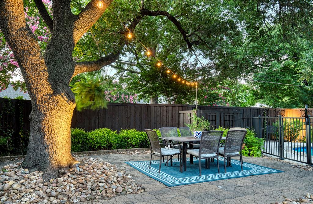 4829 Harvest Hill Dallas, TX 75244 - Photo 29 of 35 a view of a table and chairs in back yard of the house