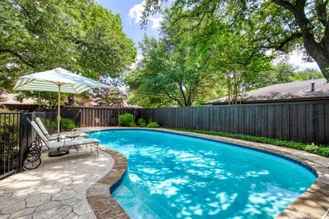 a view of a backyard with a patio