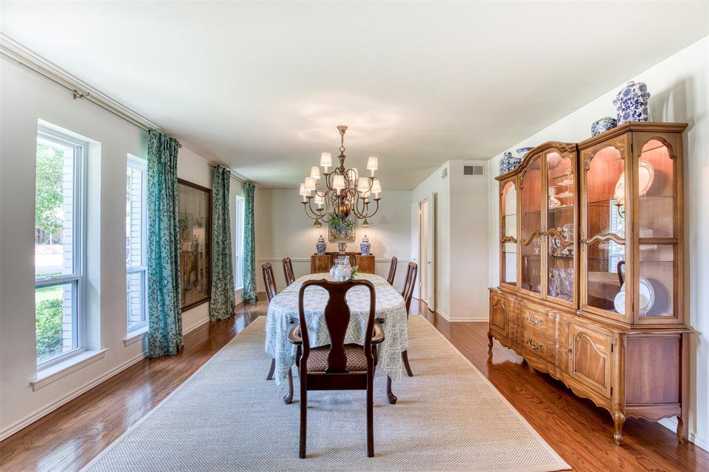 4829 Harvest Hill Dallas, TX 75244 - Photo 6 of 35 a living room with furniture and a chandelier