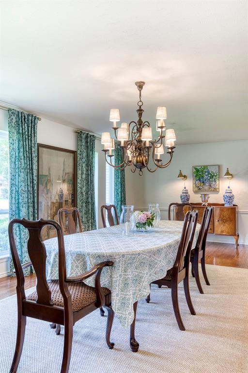 4829 Harvest Hill Dallas, TX 75244 - Photo 7 of 35 a view of a dining room with furniture and chandelier