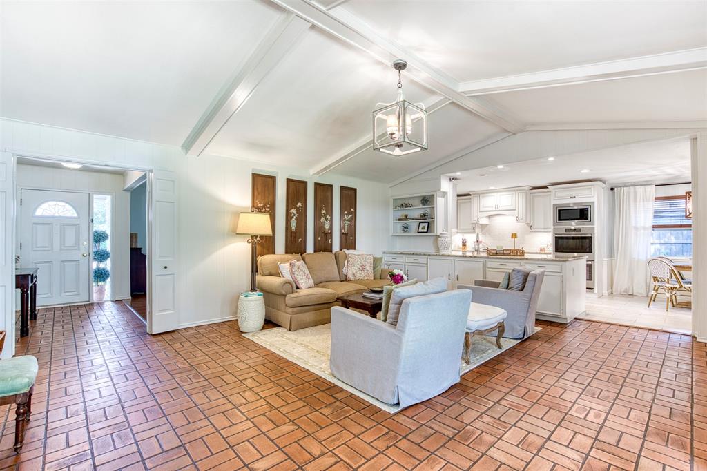 4829 Harvest Hill Dallas, TX 75244 - Photo 9 of 35 a living room with furniture and view of kitchen