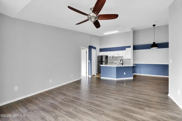 a view of kitchen with furniture and window