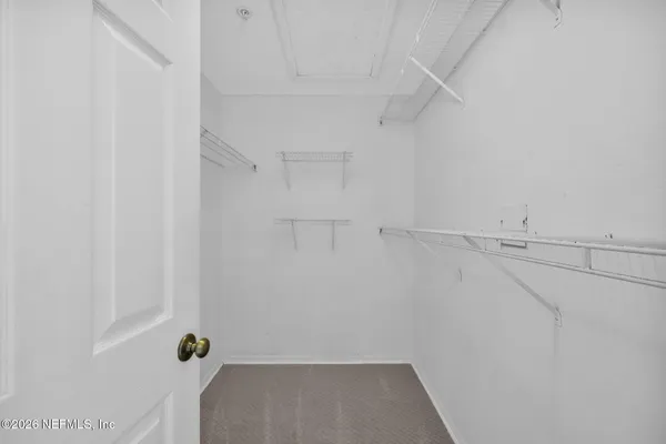 a bathroom with a sink double vanity and a mirror