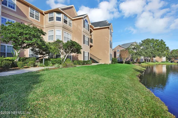 a view of a lake with building and outdoor space