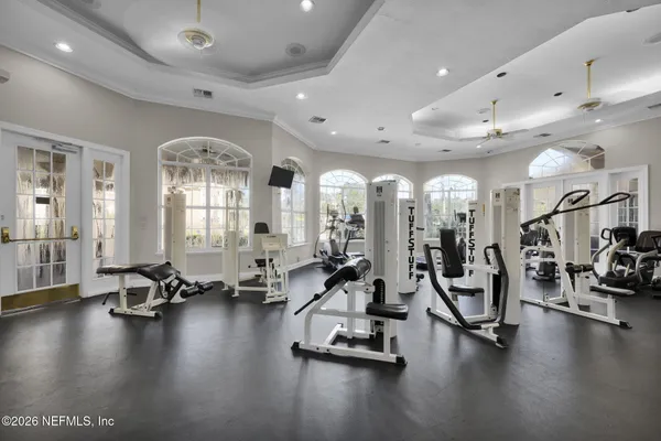 a dining room with furniture a fireplace and a large window