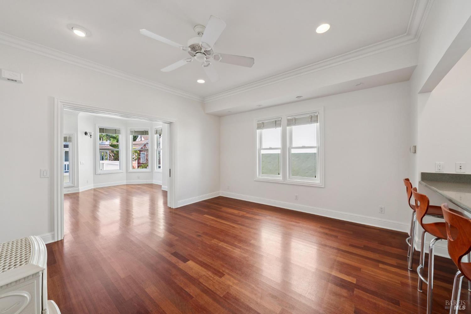 102 F Street San Rafael, CA 94901 - Photo 14 of 80 a view of an empty room with wooden floor and a window