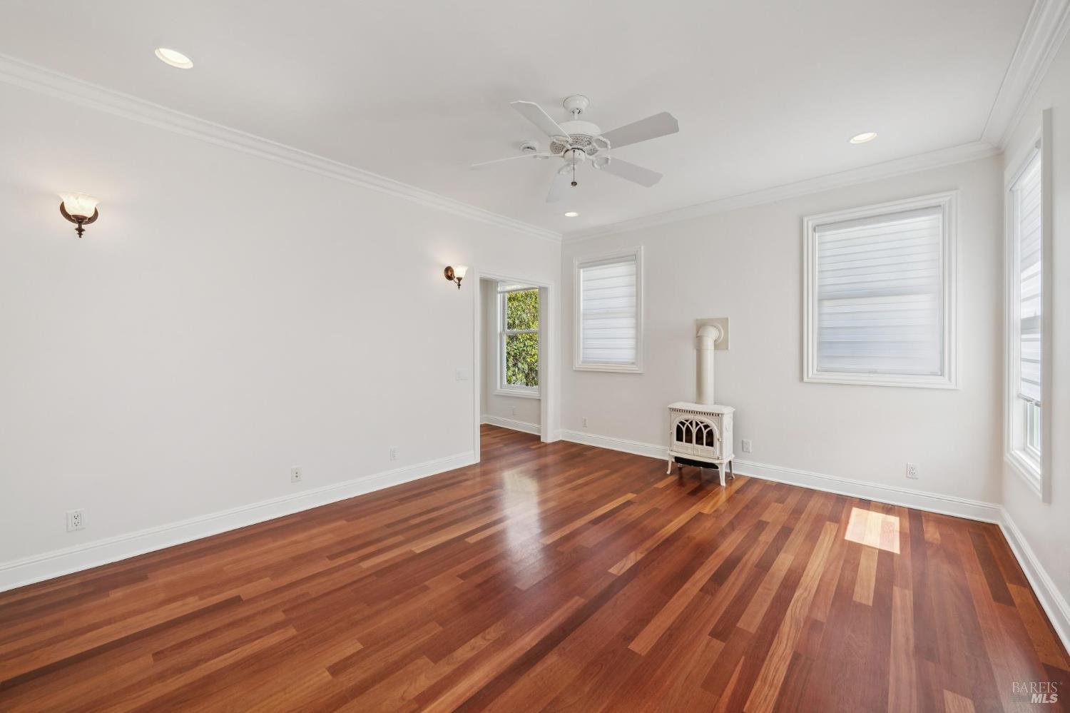 102 F Street San Rafael, CA 94901 - Photo 26 of 80 an empty room with wooden floor and windows