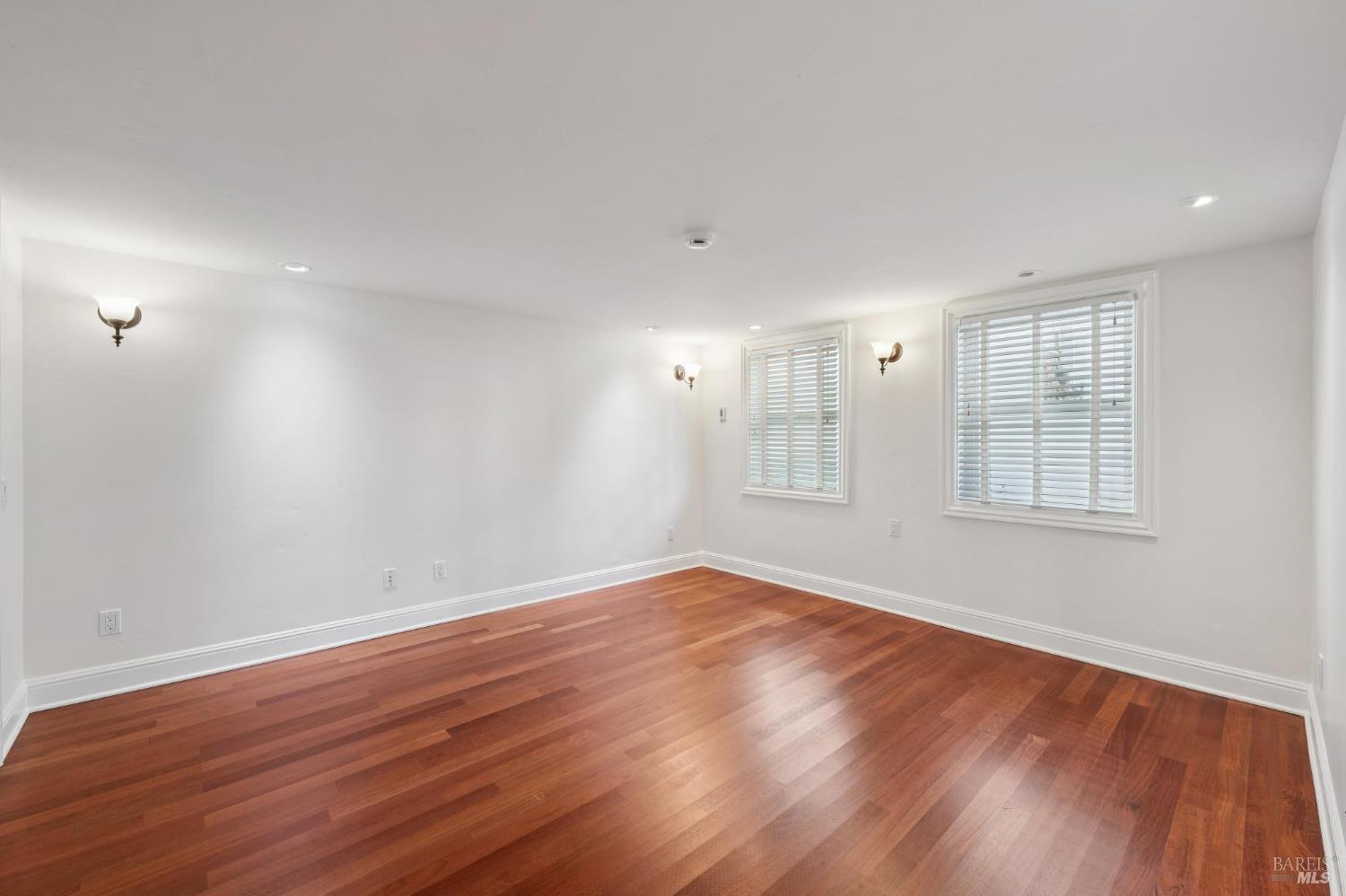 102 F Street San Rafael, CA 94901 - Photo 36 of 80 a view of an empty room with wooden floor and a window