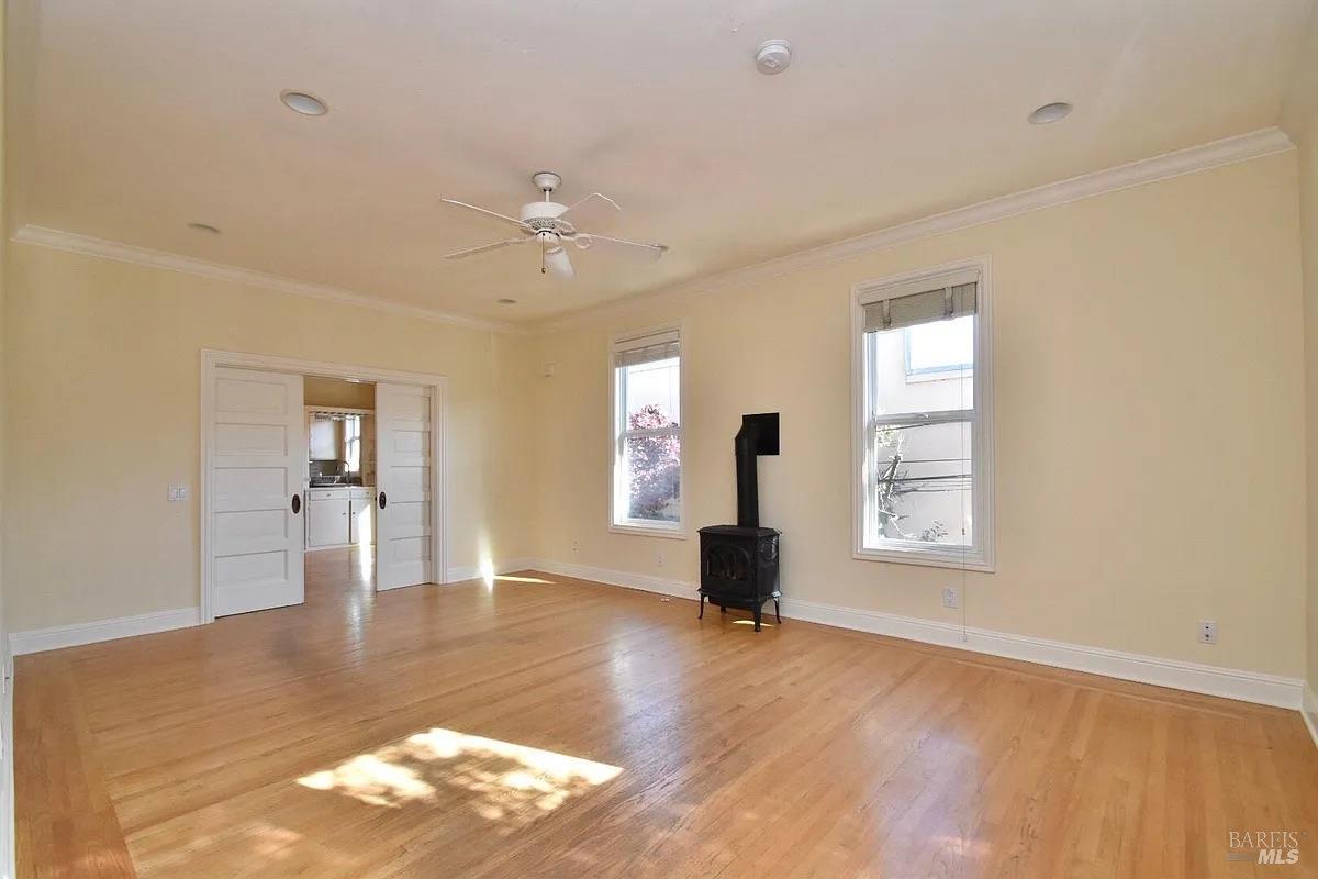 102 F Street San Rafael, CA 94901 - Photo 57 of 80 a view of empty room with wooden floor and fan