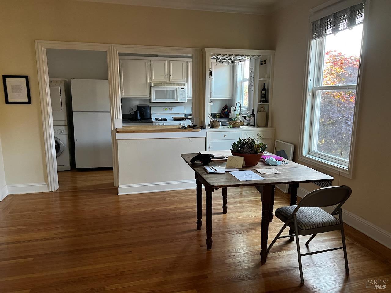 102 F Street San Rafael, CA 94901 - Photo 63 of 80 a kitchen with a table chairs refrigerator and window