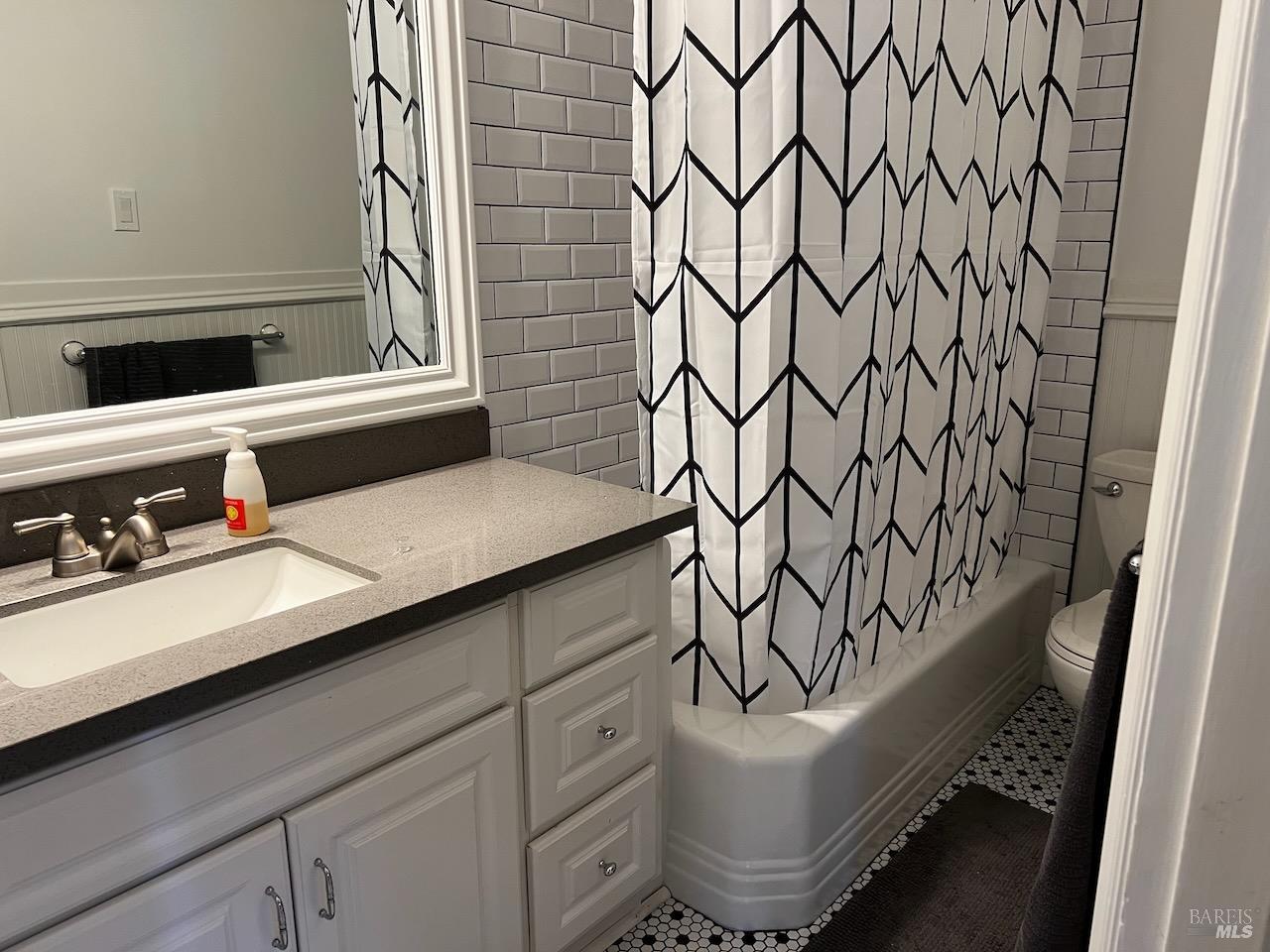 102 F Street San Rafael, CA 94901 - Photo 67 of 80 a bathroom with a sink and a mirror