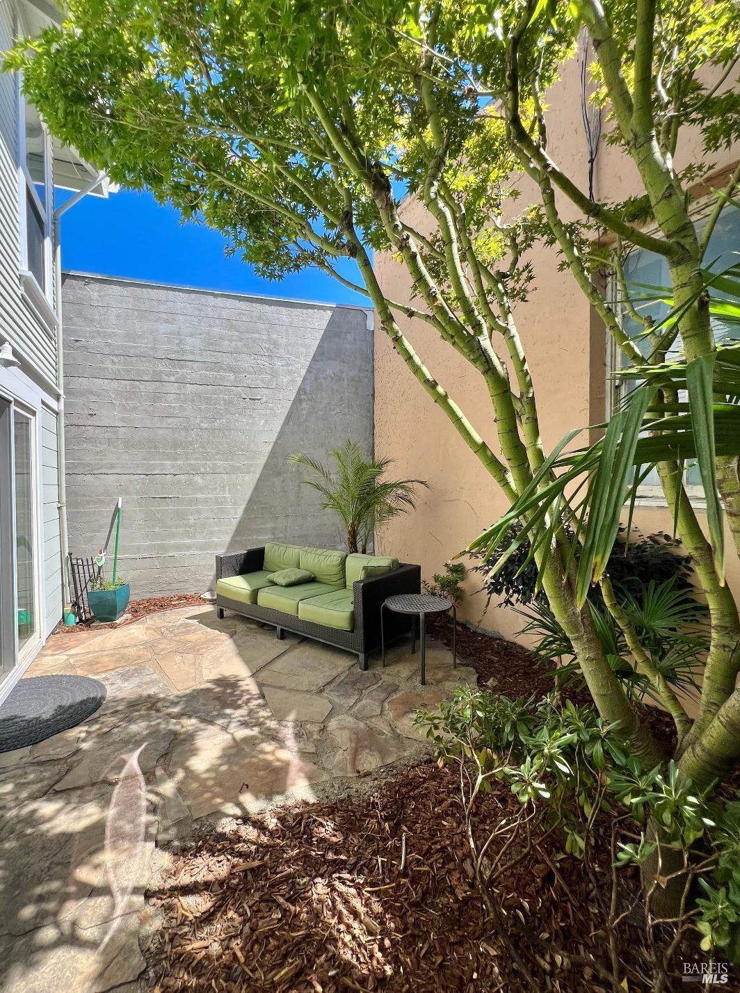 102 F Street San Rafael, CA 94901 - Photo 74 of 80 a backyard of a house with table and chairs