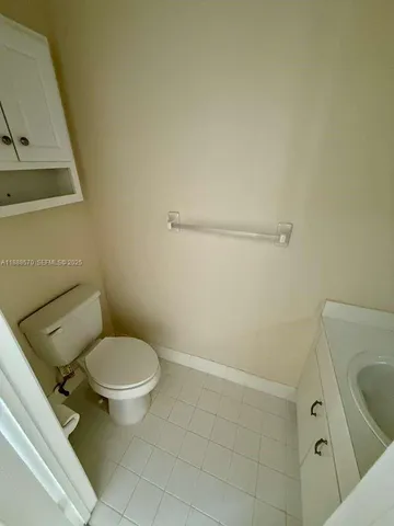 a bathroom with a toilet and a sink