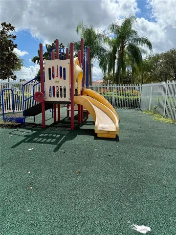 a view of a house with swimming pool and deck