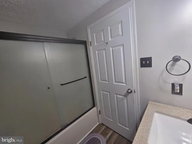 a bathroom with a sink and a shower