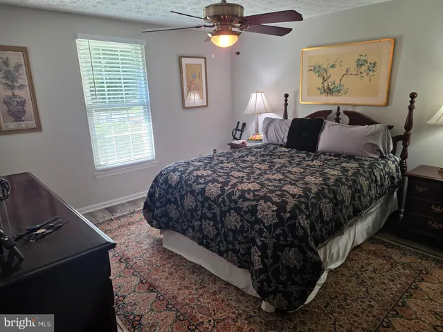 a bedroom with bed and window