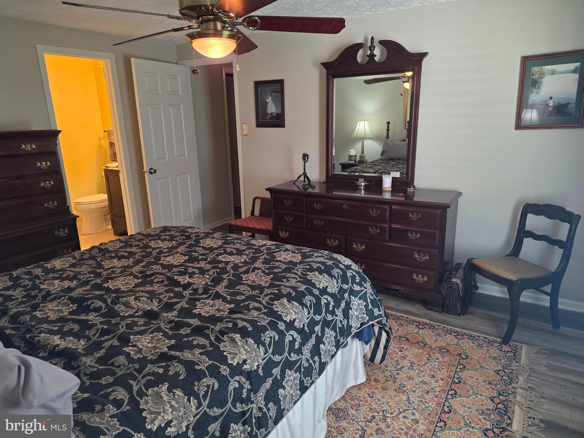 628 Southern Hills Drive, Unit B Arnold, MD 21012 - Photo 15 of 23 a bedroom with a bed and a mirror