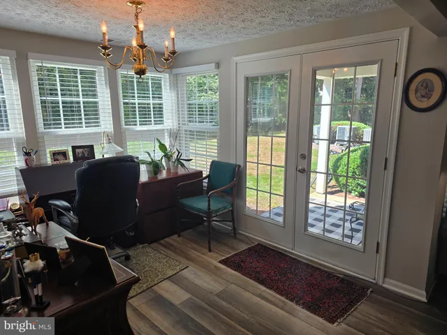 a living room with furniture and windows